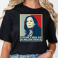 a woman wearing a black t - shirt with a picture of a woman on it