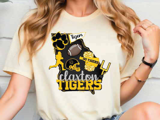 A woman wearing a white t-shirt with a graphic design featuring various sports-related icons and text.