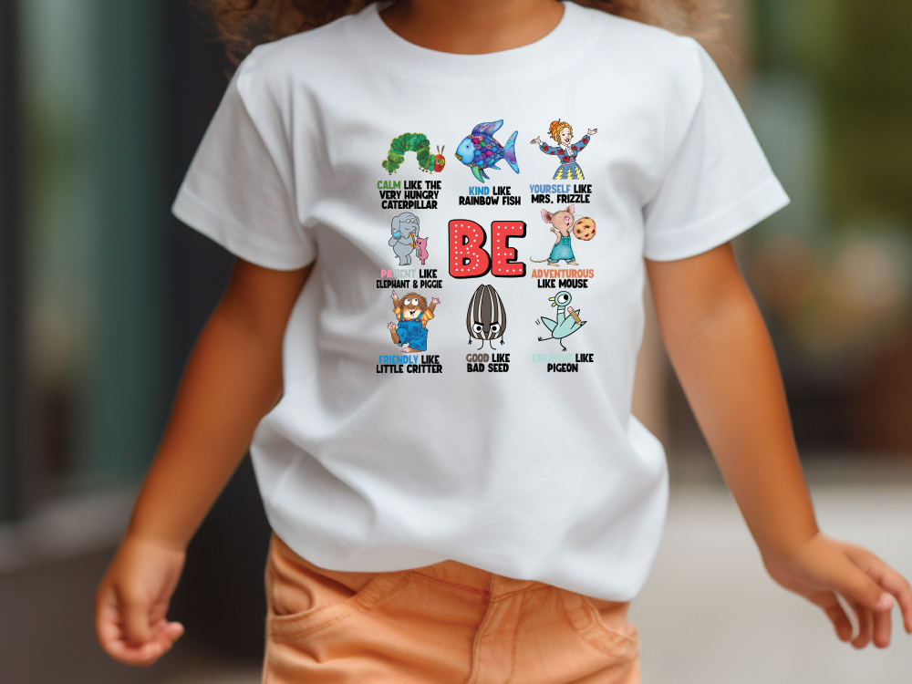 a little girl walking down a street wearing a t - shirt that says be