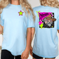 two different views of a woman wearing a light blue t-shirt with a graphic design on the back.