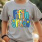 a young boy wearing a t - shirt that says fun zone