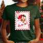 A woman wearing a green t-shirt with a Santa Claus design and the text "Ho ho ho!"