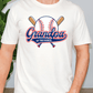 A white t-shirt with a graphic design featuring a baseball bat and a baseball, along with the text "Grandpa of the Rookie".