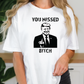 a woman wearing a t - shirt that says you missed bitch