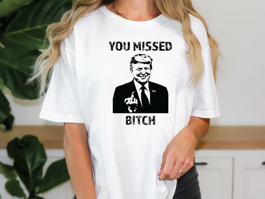 a woman wearing a t - shirt that says you missed bitch