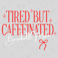 the text "Tired but Caffeinated Baseball Mom" in a stylized font, with a red ribbon graphic below it.