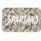 A camouflage-patterned rectangular object with the word "SPARTANS" written in a stylized, graffiti-like font.