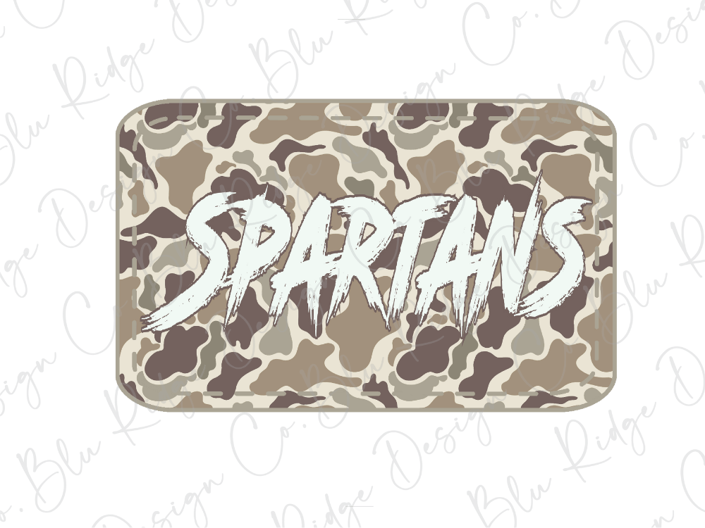 A camouflage-patterned rectangular object with the word "SPARTANS" written in a stylized, graffiti-like font.