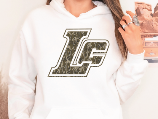 a woman wearing a white hoodie with the letter l on it