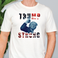 a man wearing a trump t - shirt with the words trump strong on it