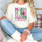 a woman sitting on a couch wearing a merry christmas t - shirt