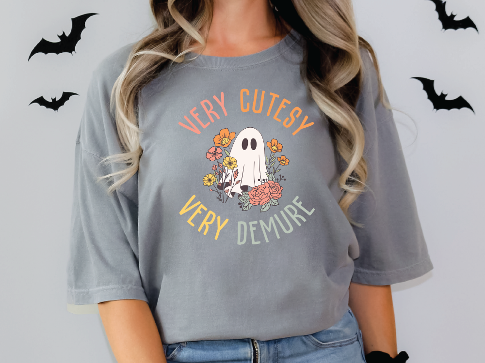 a woman wearing a grey shirt with a ghost on it