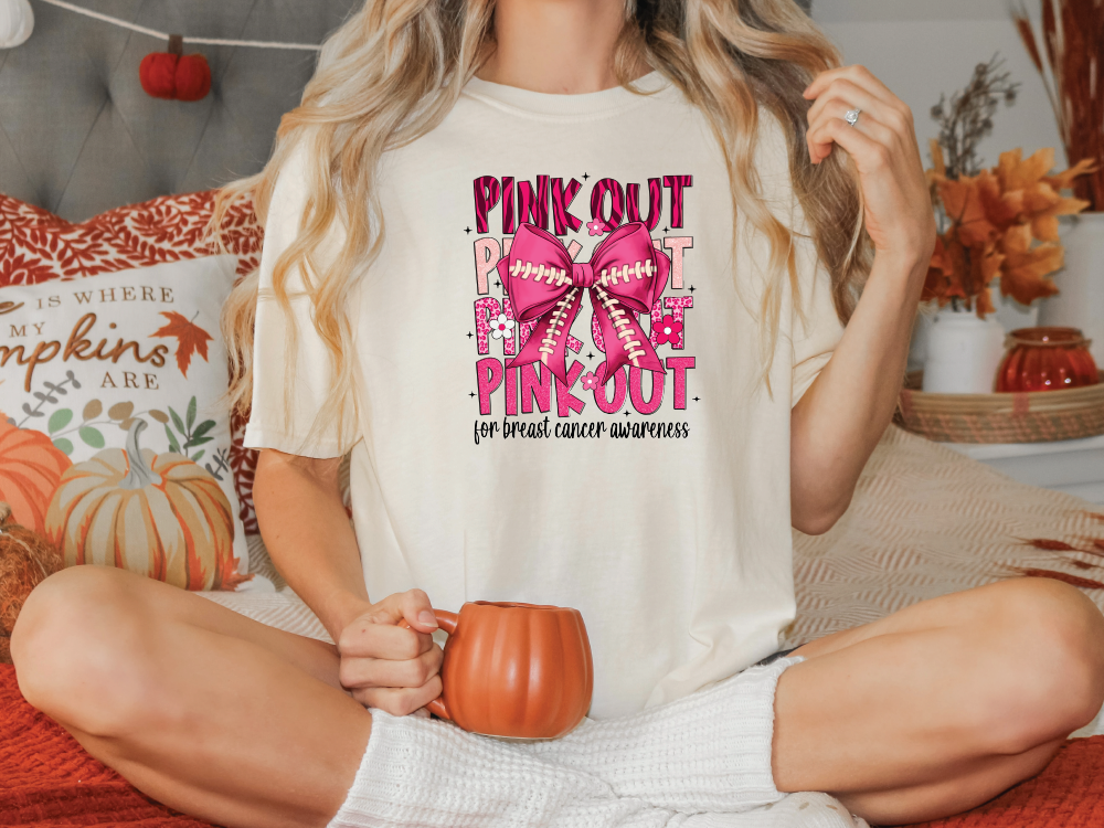 a woman sitting on a bed holding a pumpkin