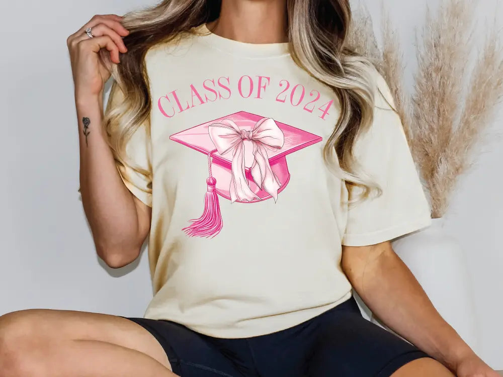 a woman wearing a class of 202 t - shirt