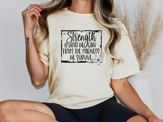 a woman wearing a t - shirt that says strength