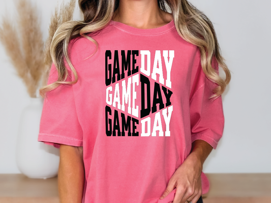 a woman wearing a pink game day t - shirt