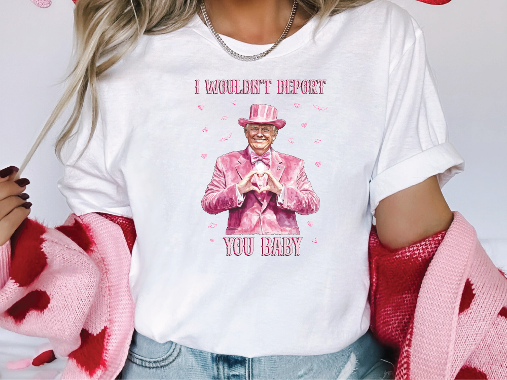 a woman wearing a t - shirt with a picture of a man in a pink