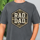 a man standing in front of a plant wearing a shirt that says rad dad