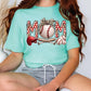 a woman wearing a mom t - shirt with a baseball on it