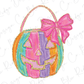 a colorful pumpkin with a pink bow on it