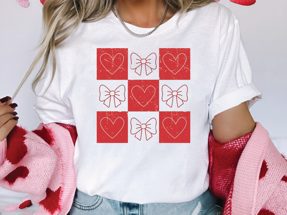 a woman wearing a t - shirt with hearts on it