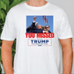 a man wearing a t - shirt that says you missed trump