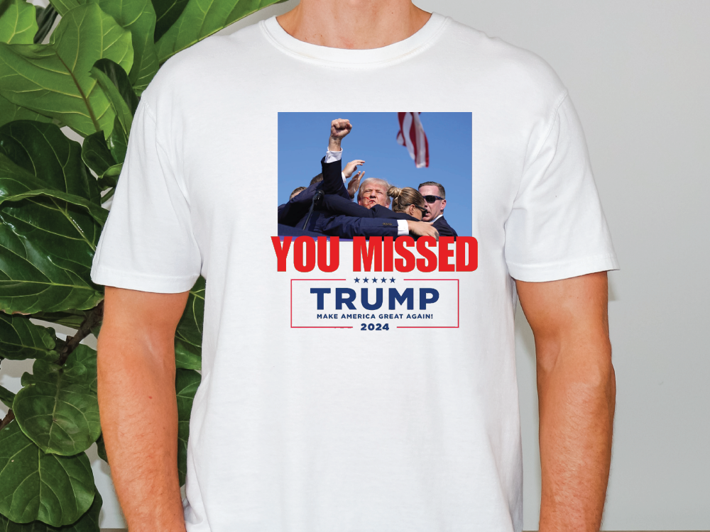 a man wearing a t - shirt that says you missed trump