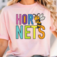 A woman wearing a pink t-shirt with the text "HOR NETS" printed on it, featuring a cartoon bee character.