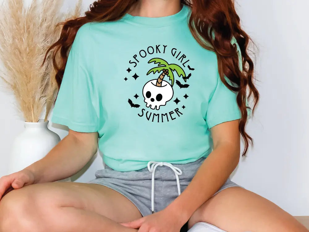 a woman wearing a green shirt with a skull on it