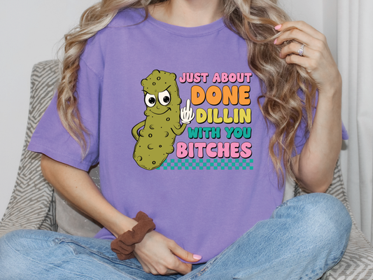 a woman wearing a purple shirt that says just about done dilling with you bitch