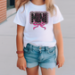 a little girl wearing a white shirt and jean shorts