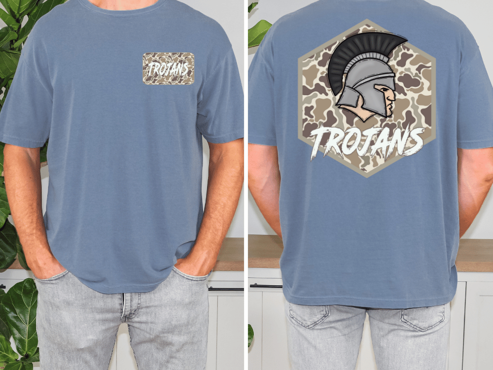 A man wearing a blue t-shirt with a graphic of a helmet and the word "TROANS" printed on it.