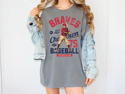 a woman wearing a baseball t - shirt and denim jacket