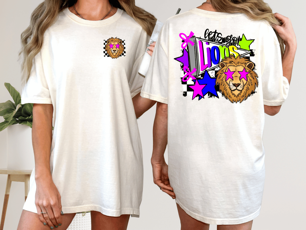 A white t-shirt with a colorful graphic design on the back, featuring a lion and various stars and shapes.