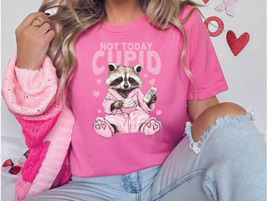 a woman wearing a pink shirt with a raccoon on it