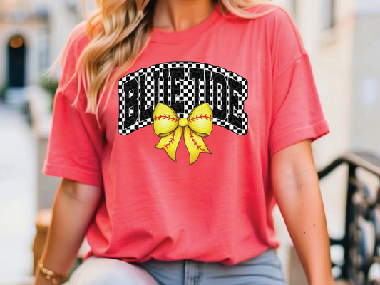 A woman wearing a red t-shirt with a checkered black and white design and a yellow bow on it.