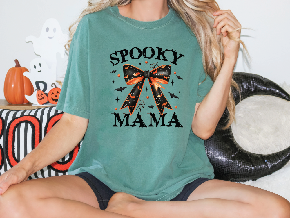 a woman wearing a spooky mama shirt