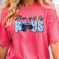 a woman wearing a pink shirt with a monster truck on it
