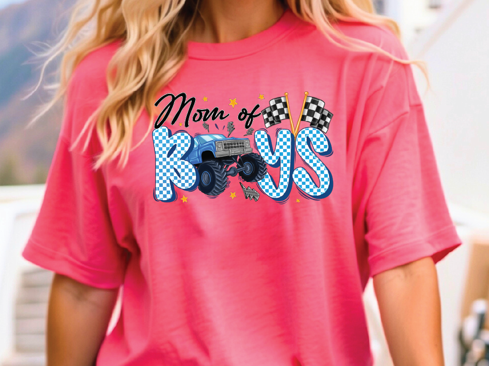 a woman wearing a pink shirt with a monster truck on it