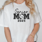 a woman wearing a t - shirt that says senior mom