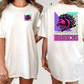 A woman wearing a white t-shirt with a graphic design of a stylized horse and the word "BRONCO" printed on the back.
