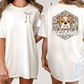 two different views of a white t-shirt with a graphic design on the back. The design features a bulldog with a camouflage pattern and the text "Bulldogs" written below the bulldog.