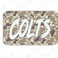 A camouflage-patterned rectangular object with the word "COLTS" written in a bold, white font.
