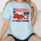 a woman sitting on a couch wearing a baseball mom shirt