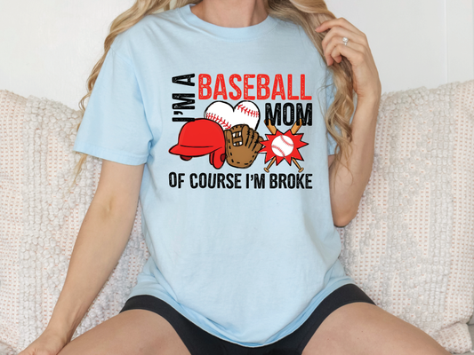 a woman sitting on a couch wearing a baseball mom shirt