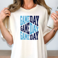 a woman is holding a cup and a game day t - shirt