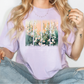 a woman wearing a t - shirt with flowers on it