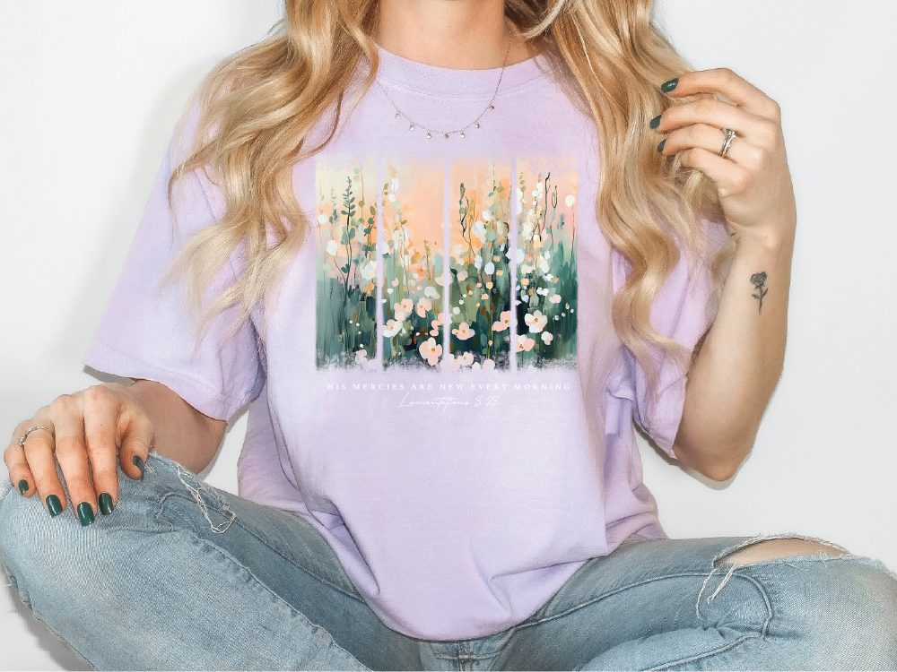 a woman wearing a t - shirt with flowers on it