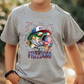 a young boy wearing a t - shirt with a fish on it