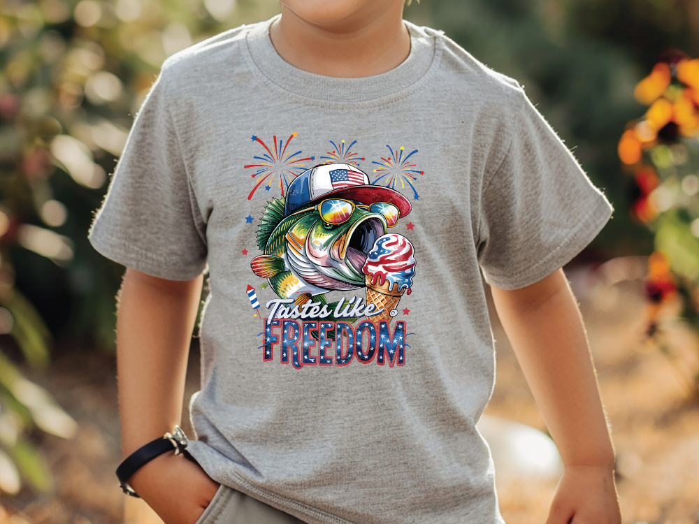 a young boy wearing a t - shirt with a fish on it